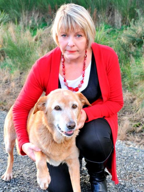Alison Sinclair with her dog Honey, who was caught in a gin trap in Frasers Gully for almost 24...