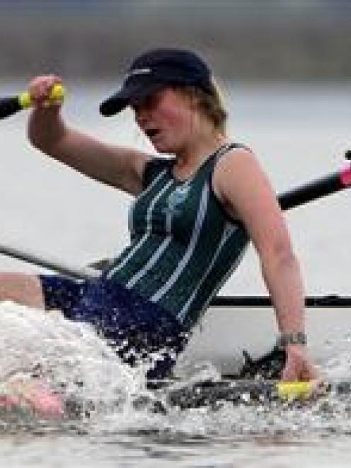 Alivia Anderson (14, left) and Sara Griffin (14), of Columba College, catch their breath on the...