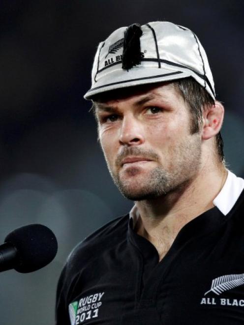 All Black captain Richie McCaw received his 100th test cap after the World Cup match against...