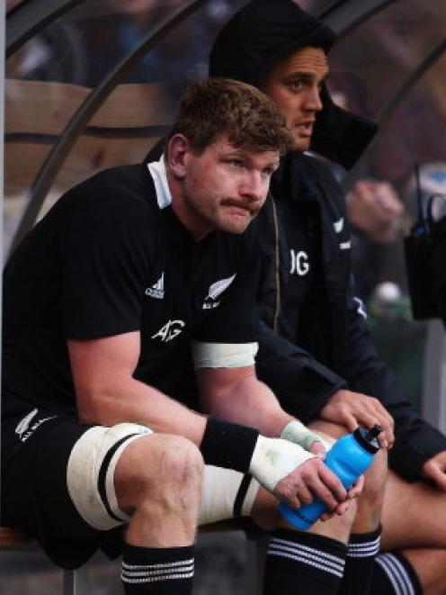 All Black flanker Adam Thomson sits in the sin bin after being given a yellow card during the...