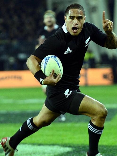 All Black halfback Aaron Smith celebrates before scoring the crucial try in the second half....