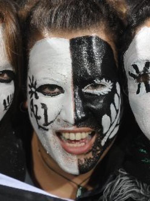 All Black supporters from left Liana Chen, Willow Folwell and Renata Burt, students of Dunedin,...