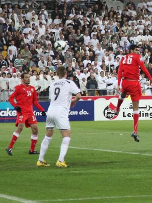 All White Rory Fallon heads the ball into the Bahrain goal, shattering the visitors' dreams....