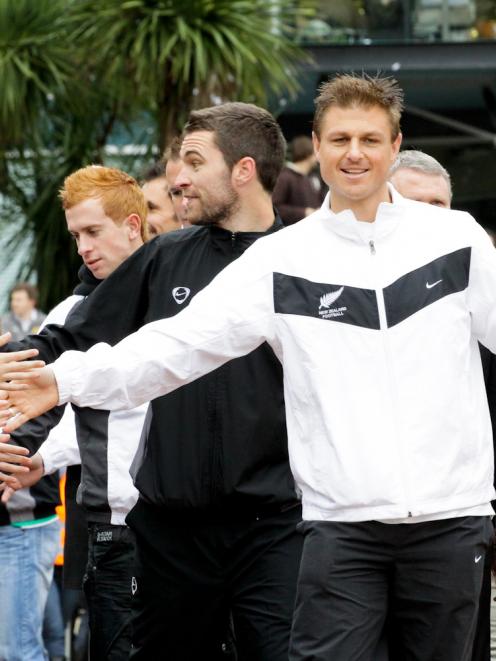 All Whites players greet fans during a parade in Wellington's Civic Square after their World Cup...