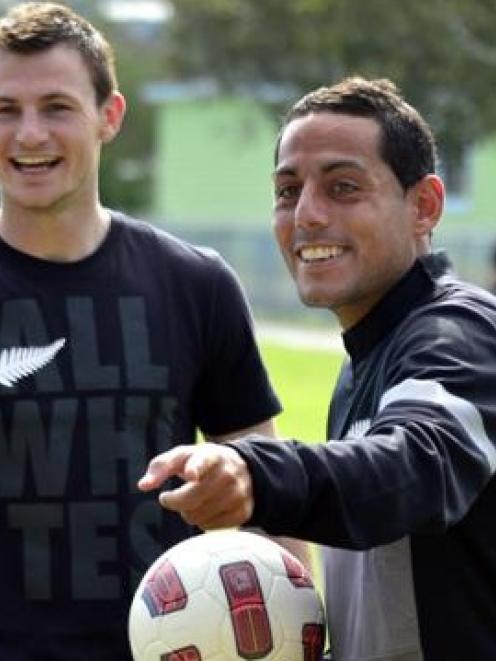 All Whites Tommy Smith and Leo Bertos.