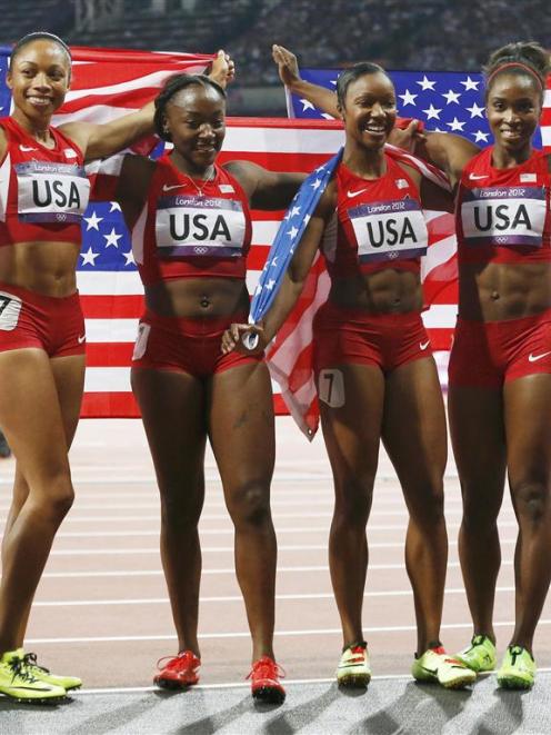 Allyson Felix, Bianca Knight, Carmelita Jeter and Tianna Madison of the US celebrate after they...