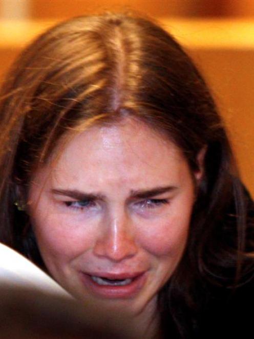 Amanda Knox reacts as she hears that she has been cleared of murder. REUTERS/PierPaolo Cito/Pool