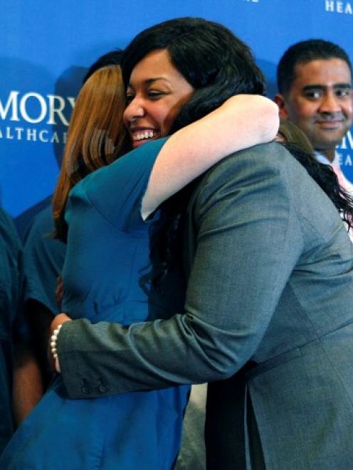 Amber Vinson hugs caregivers before leaving Emory University Hospital in Atlanta, Georgia....