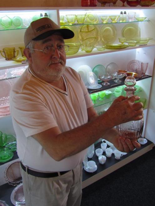 American Depression glass collector Bruce Comfort with one of his favourite pieces, a decanter,...