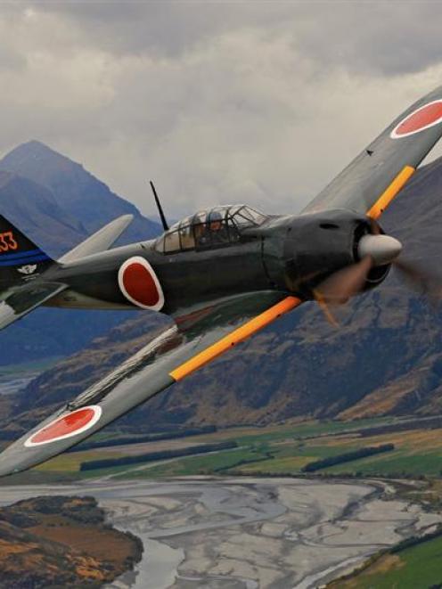 American pilot Steve Barber flies a rare Japanese Mitsubishi A6M Zero fighter plane above the...