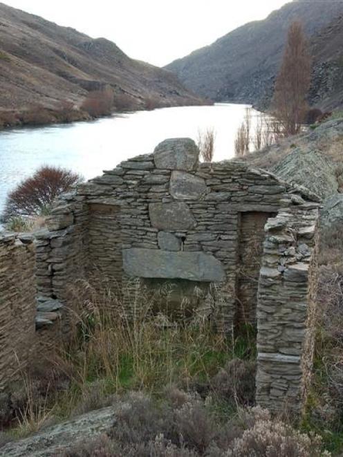 An abandoned gold-miner's cottage in the Roxburgh Gorge, beside Lake Roxburgh. Photo by Stephen...