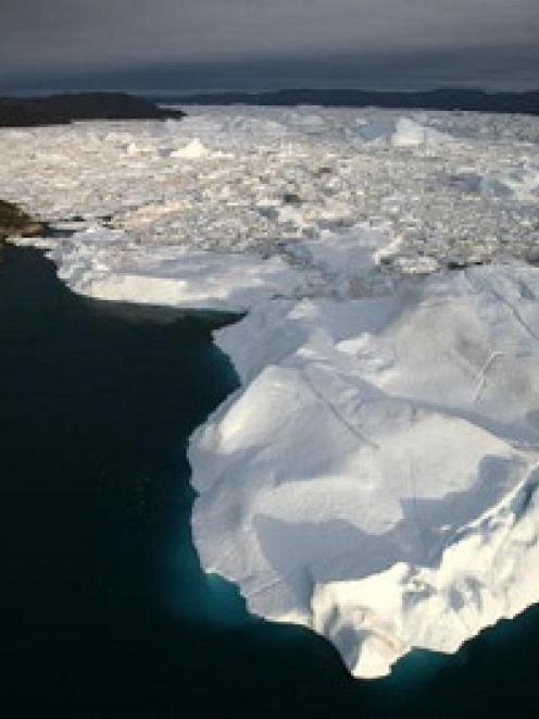 An aerial view of icebergs as they float out of the Jacobshavn Fjord, Greenland, in this 2007...