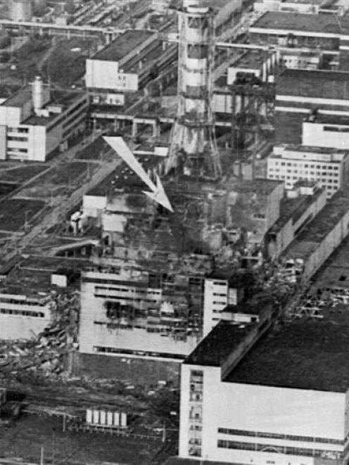 An aerial view of the Chernobyl nuclear power plant. The arrow shows the spot of the accident. A...
