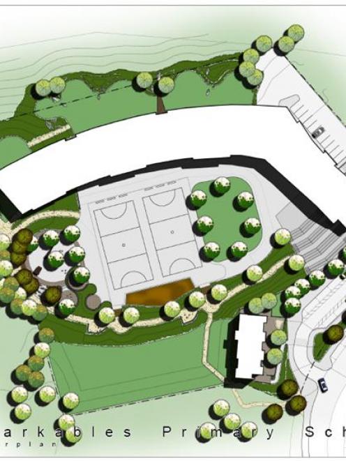 An aerial view of the school shows the five "learning pods" on two levels in the main block, an...