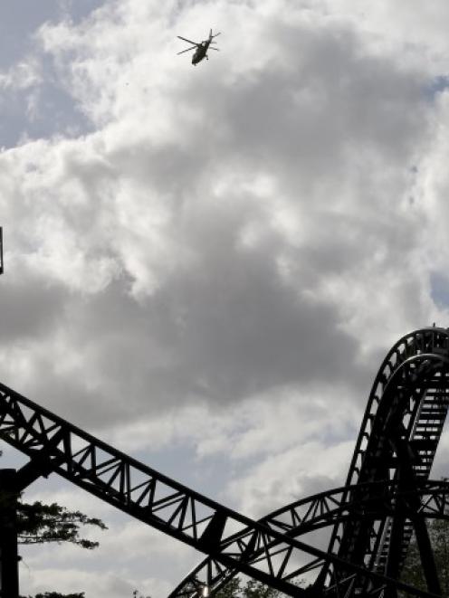An air ambulance flies over the Smiler ride at Alton Towers after the crash last week. Photo Reuters