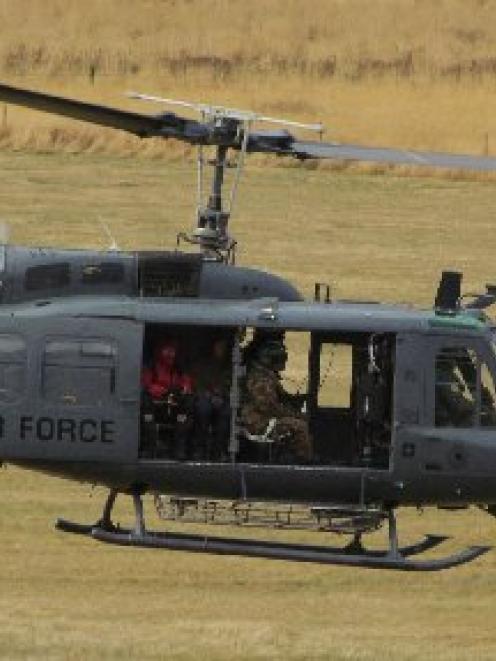 An air force helicopter takes off during the search for missing Dunedin tramper David Palmer.