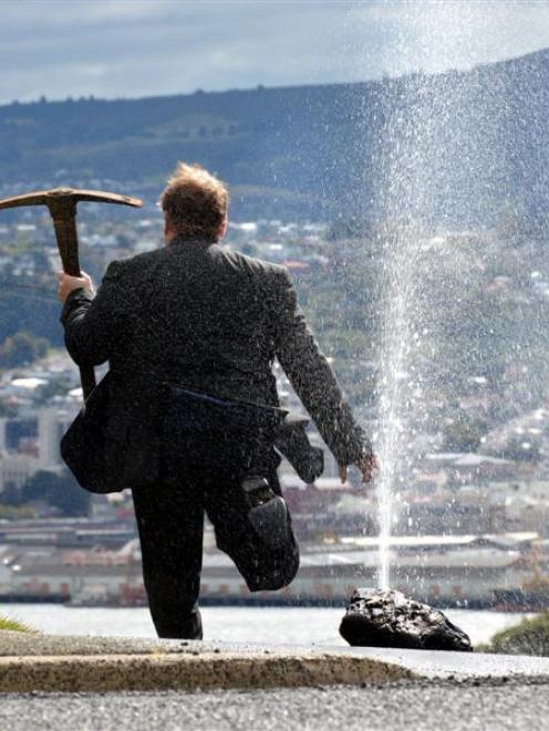 An angry ratepayer destroys his recently installed water meter after learning of Dunedin City...