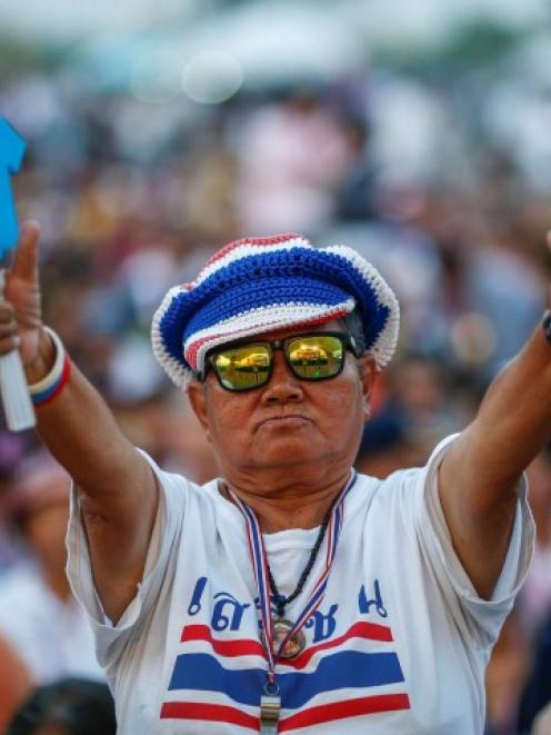 An anti-government protester gestures during a rally at Government complex in Bangkok. REUTERS...