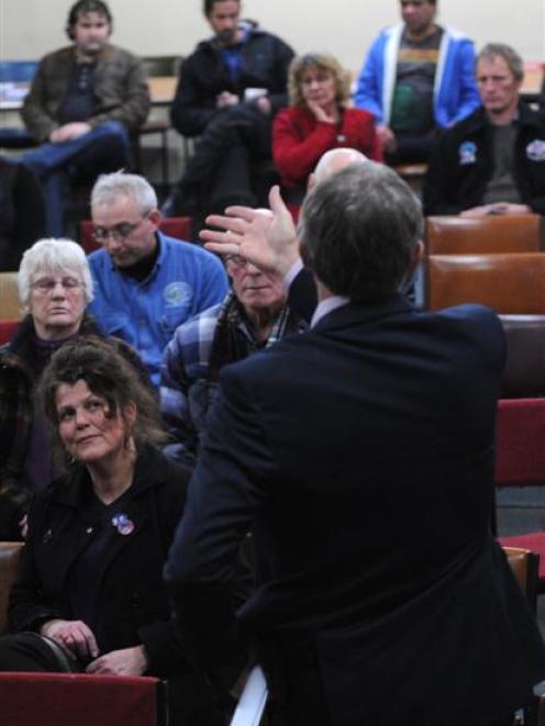 An audience in Dunedin last night listens as Labour leader Phil Goff explains the party's new...