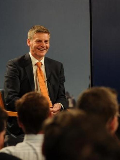 An audience member asks a question of Finance Minister Bill English. Photo by Peter McIntosh.
