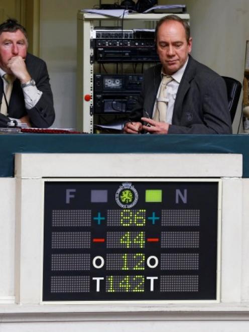 An electronic voting board shows the results of a vote on a law to allow euthanasia for...