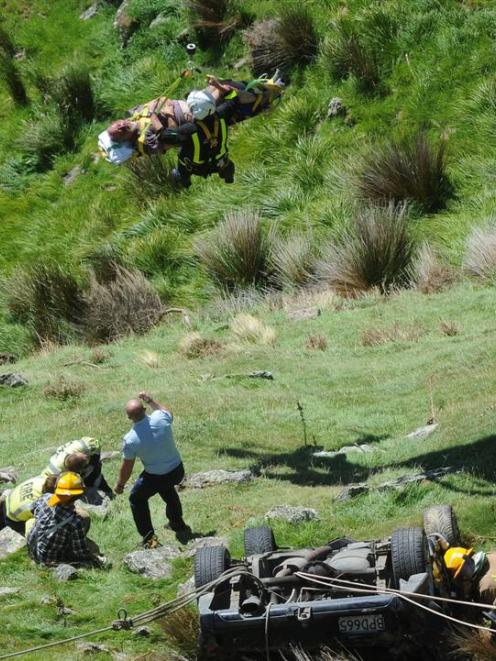 An injured man is winched to safety by the Otago Regional Rescue Helicopter. Photo by Craig Baxter