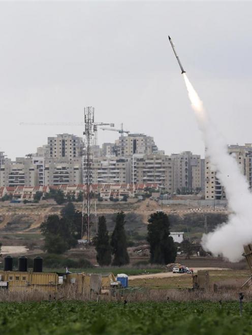 An Iron Dome launcher fires an interceptor rocket near the Israeli city of Ashkelon. REUTERS...