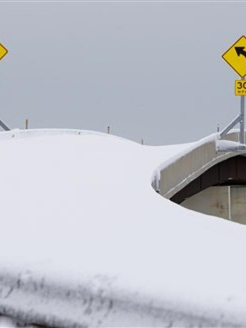 An off ramp is seen covered with snow during a winter storm in Baltimore.  (AP Photo/Carolyn Kaster)