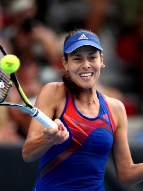 Ana Ivanovic plays a forehand on her way to victory over Venus Williams. (Photo by Phil Walter...