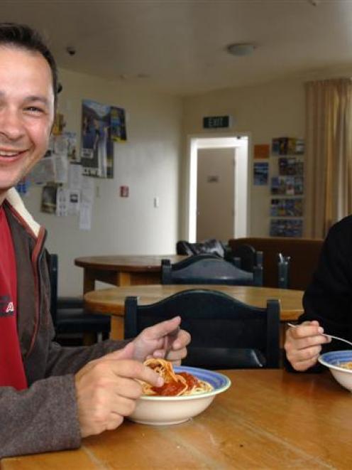 Andre Peklaj and Simone Jager, from Germany, with their meal of pasta at On Top Backpackers....