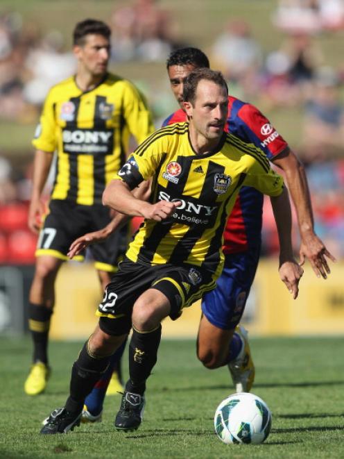 Andrew Durante of the Phoenix on the ball against the Newcastle Jets.  (Photo by Tony Feder/Getty...