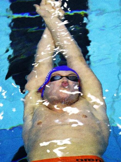 Andrew Trembath (Neptune) wins the boys aged 17 and 18 100m backstroke at the New Zealand age...