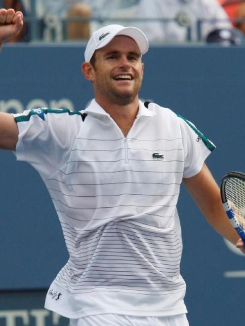 Andy Roddick of the US celebrates his win over Julien Benneteau of France during their match at...