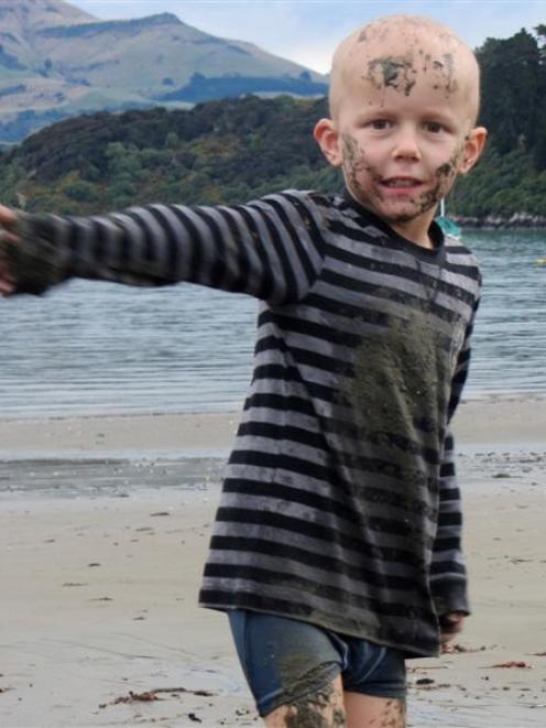 Angus Beaton (5), at Akaroa Beach on Saturday after receiving good news about his condition  from...