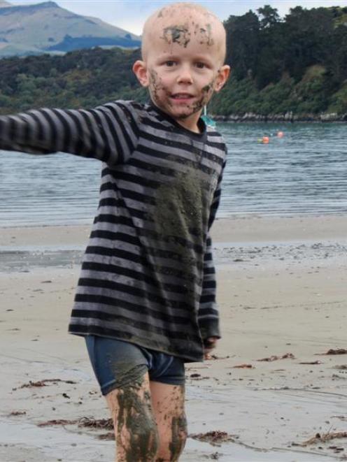 Angus Beaton  plays at Akaroa Beach on Saturday after receiving good news from the doctor.  Photo...