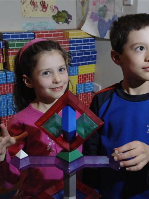 Annelise (5) and William Scharpf (8) use a complex building toy in their Dunedin home. Photo by...