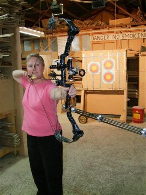 Balclutha archer Anne Mitchell gets in some last-minute practice at work before leaving to attend...