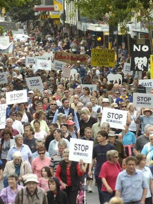 Anti-stadium demonstrators make their way way down George St today. Photo by Peter McIntosh