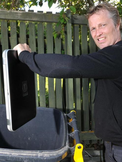 App developer Glenn Linde (44) dumps his laptop after Google closed his Android developer account...