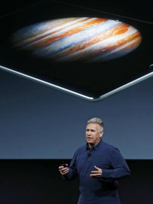 Apple senior vice-president of worldwide marketing Philip Schiller introduces the iPad Pro during...