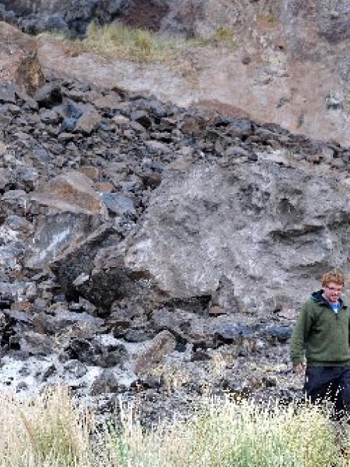 Aramoana resident Bradley Curnow, with his Department of Conservation-issued hard hat, surveys a...