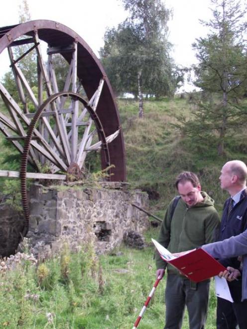 Archaeologist Andrew Winter (left), conservation surveyor Robin Miller and trust member Carol...