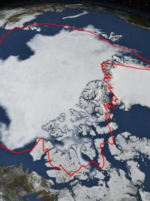 Arctic sea ice hits its annual minimum as seen in this satellite picture. The red line  shows the...