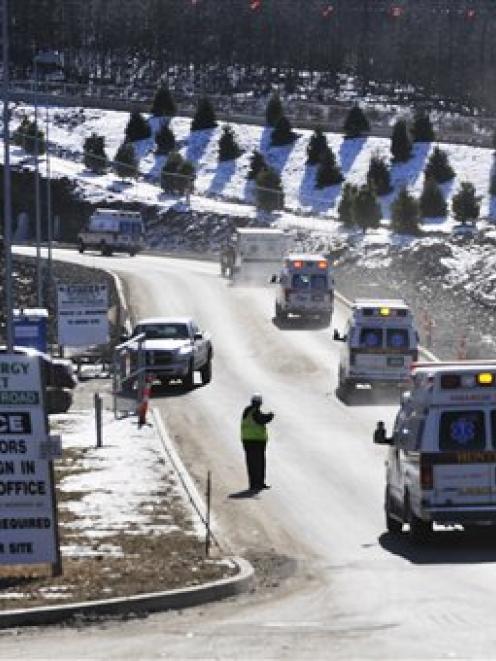 Area fire and ambulance crews arrive near the scene in Middletown, Connecticut where multiple...