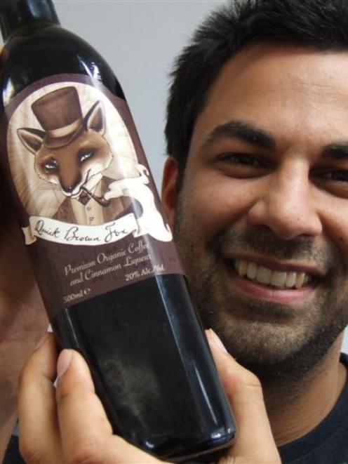 Arjun Haszard with his coffee and cinnamon liqueur Quick Brown Fox. Photo by Sally Rae