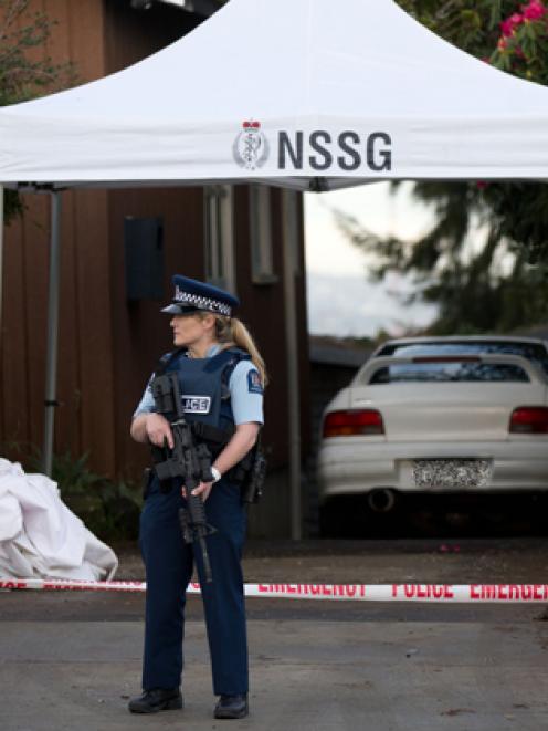 Armed police guard the scene where Connor Morris was fatally attacked. Photo: NZ Herald/Richard...