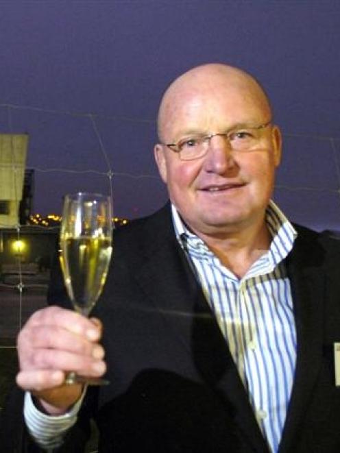 Arrow International Group Ltd director and founder Ron Anderson raises his glass at the...