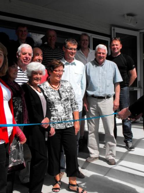 Arrowtown Bowling Club life member Taylor Reed cuts the  ribbon on  the  building's new $150,000...