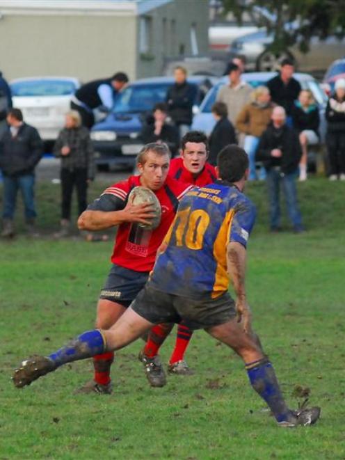 Arrowtown first five-eighth Reece Winter looks to step around Sam Young during last year's Otago...