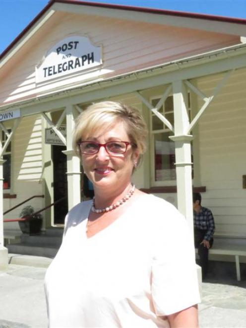 Arrowtown Post Office postal assistant Jane Douglas outside the historic building, which will...